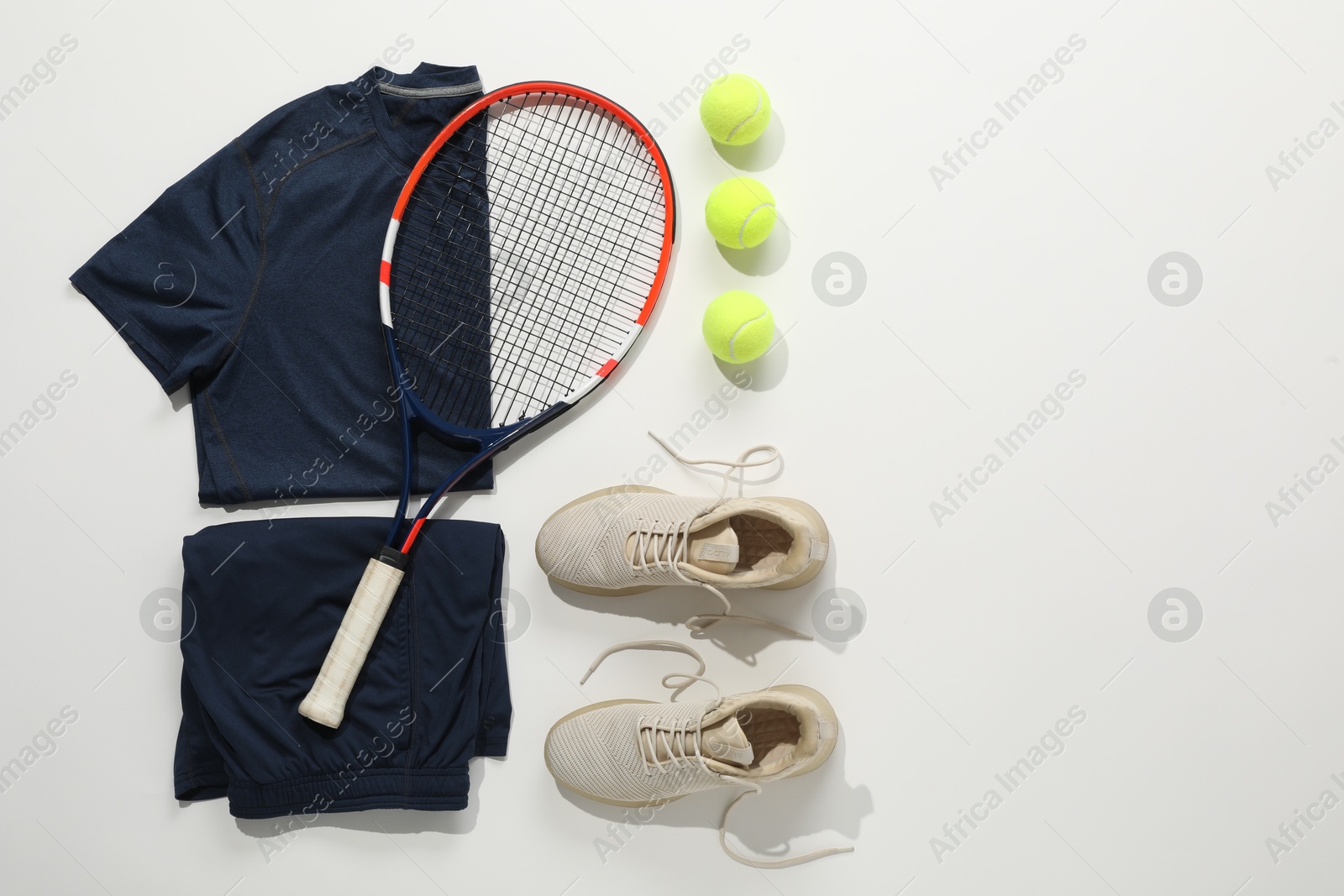 Photo of Flat lay composition with tennis racket and balls on light background. Space for text