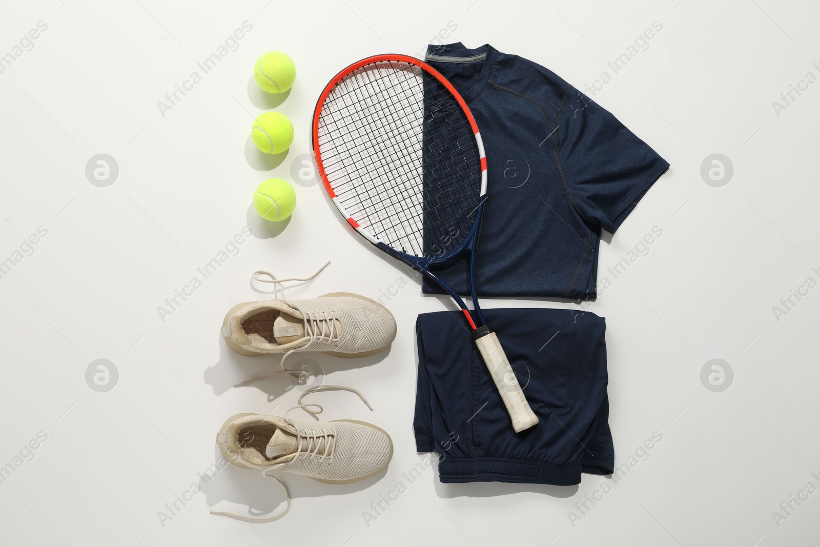 Photo of Flat lay composition with tennis racket and balls on light background