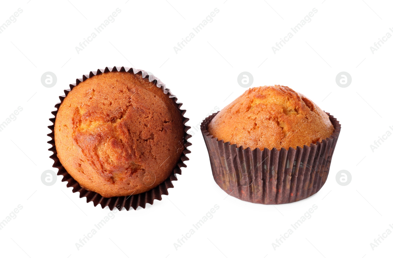 Photo of Two delicious sweet muffins isolated on white