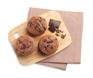 Photo of Delicious sweet muffins with chocolate chips isolated on white, top view