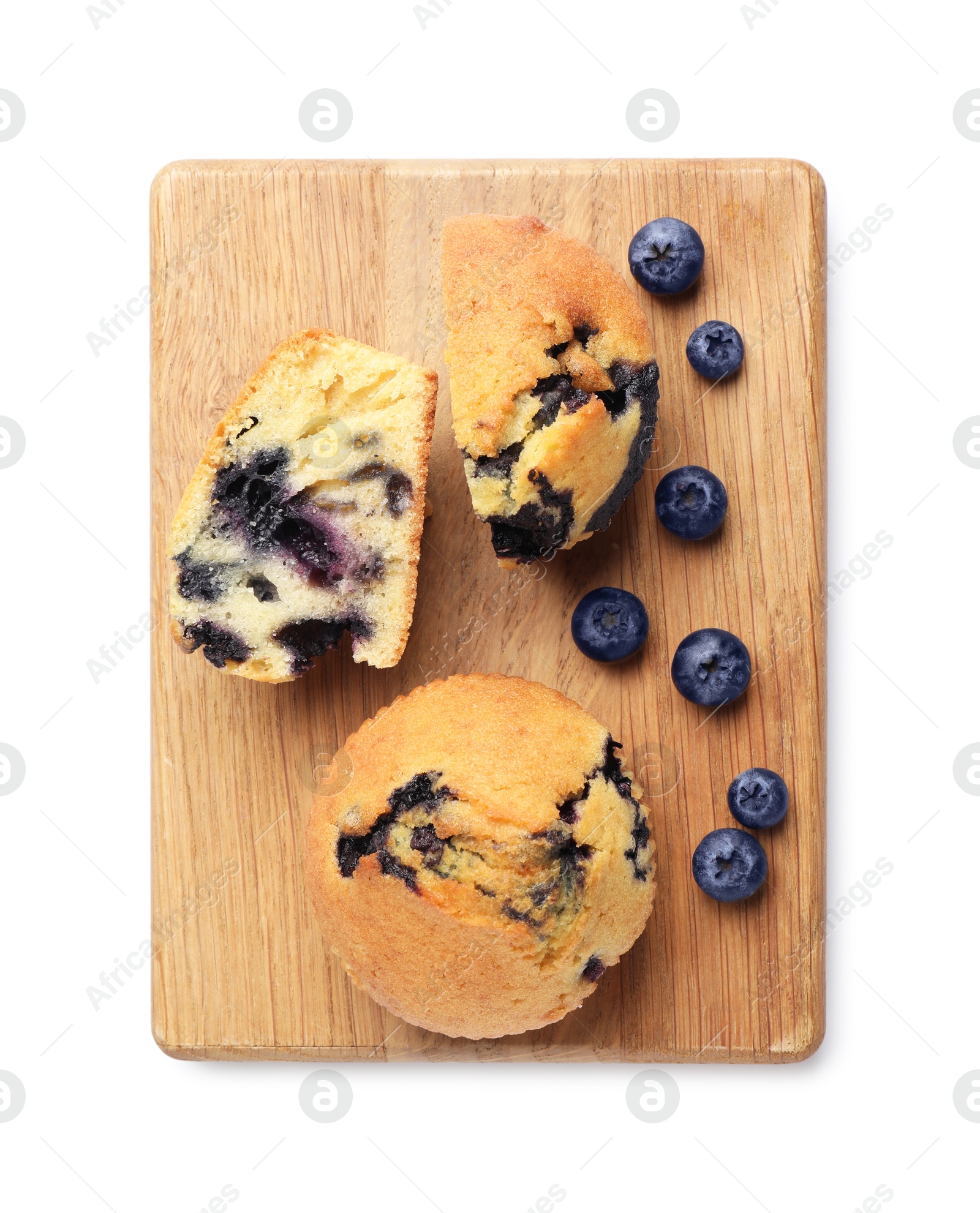 Photo of Delicious sweet muffins with blueberries isolated on white, top view