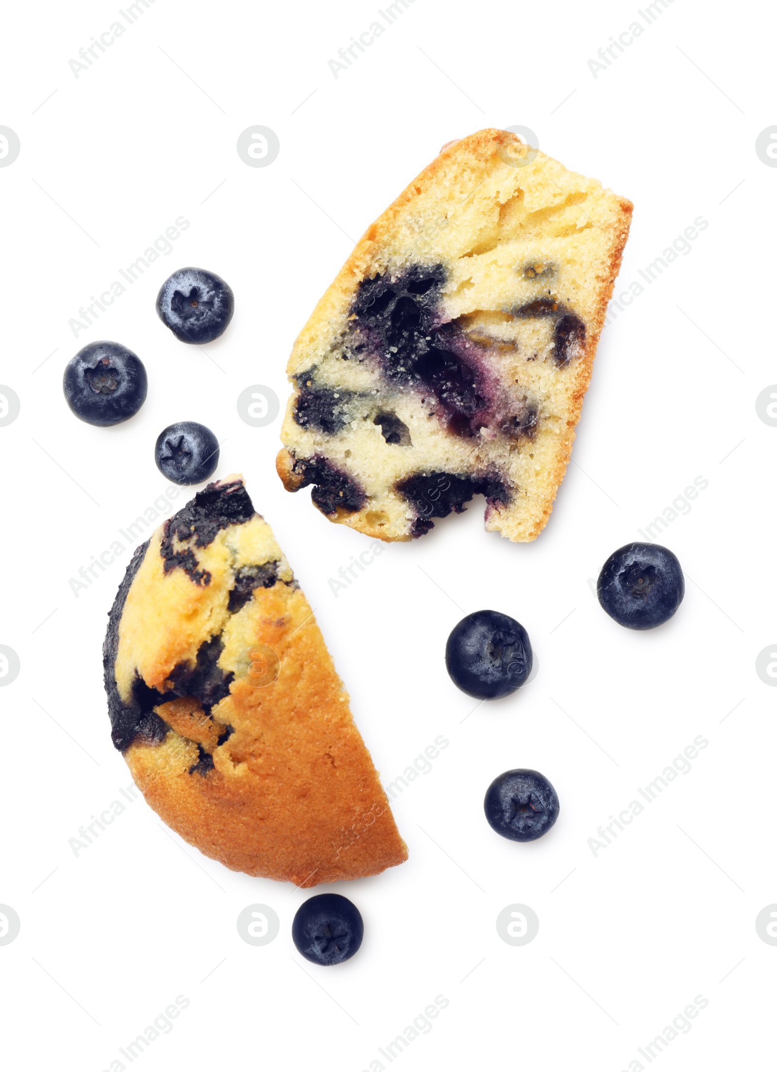 Photo of Pieces of delicious sweet muffin and blueberries isolated on white, top view