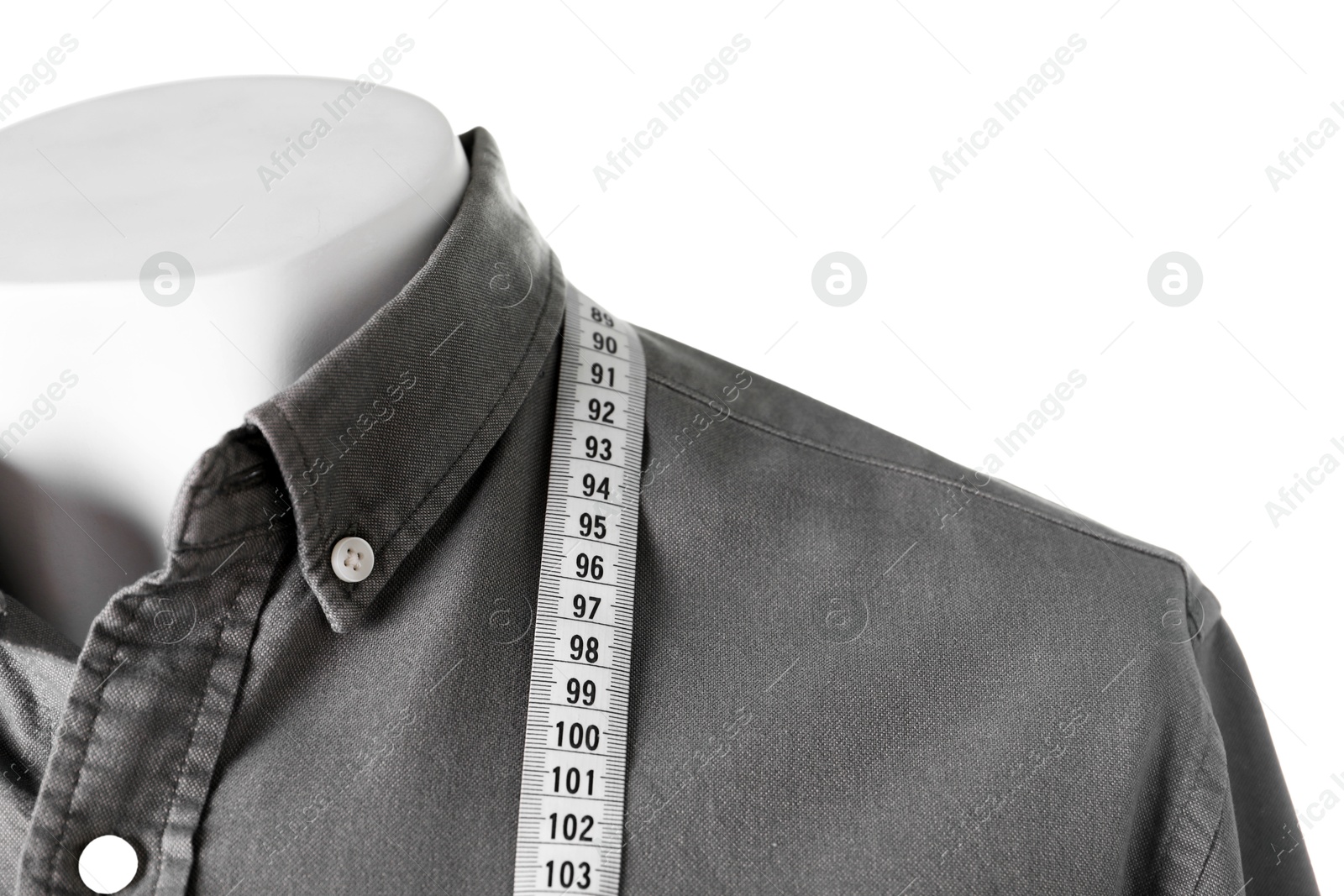 Photo of Mannequin with shirt and measuring tape isolated on white