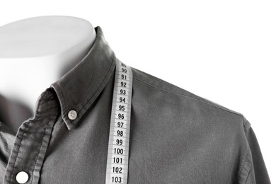 Mannequin with shirt and measuring tape isolated on white