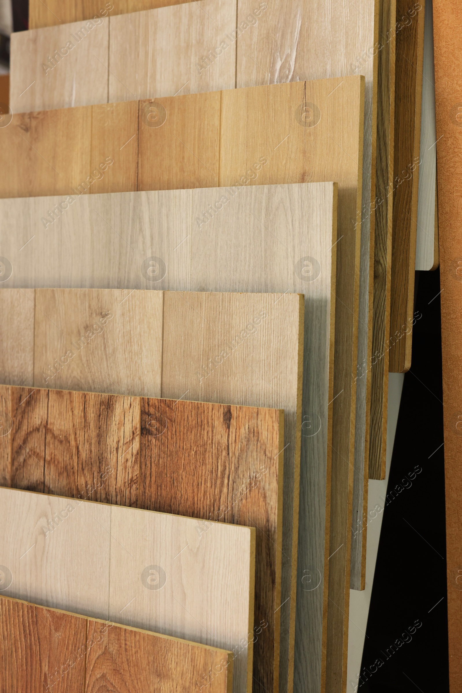 Photo of Many different samples of wooden flooring in store