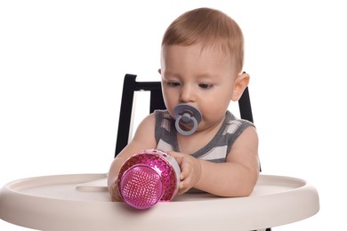 Cute little baby with pacifier and microphone in high chair on white background