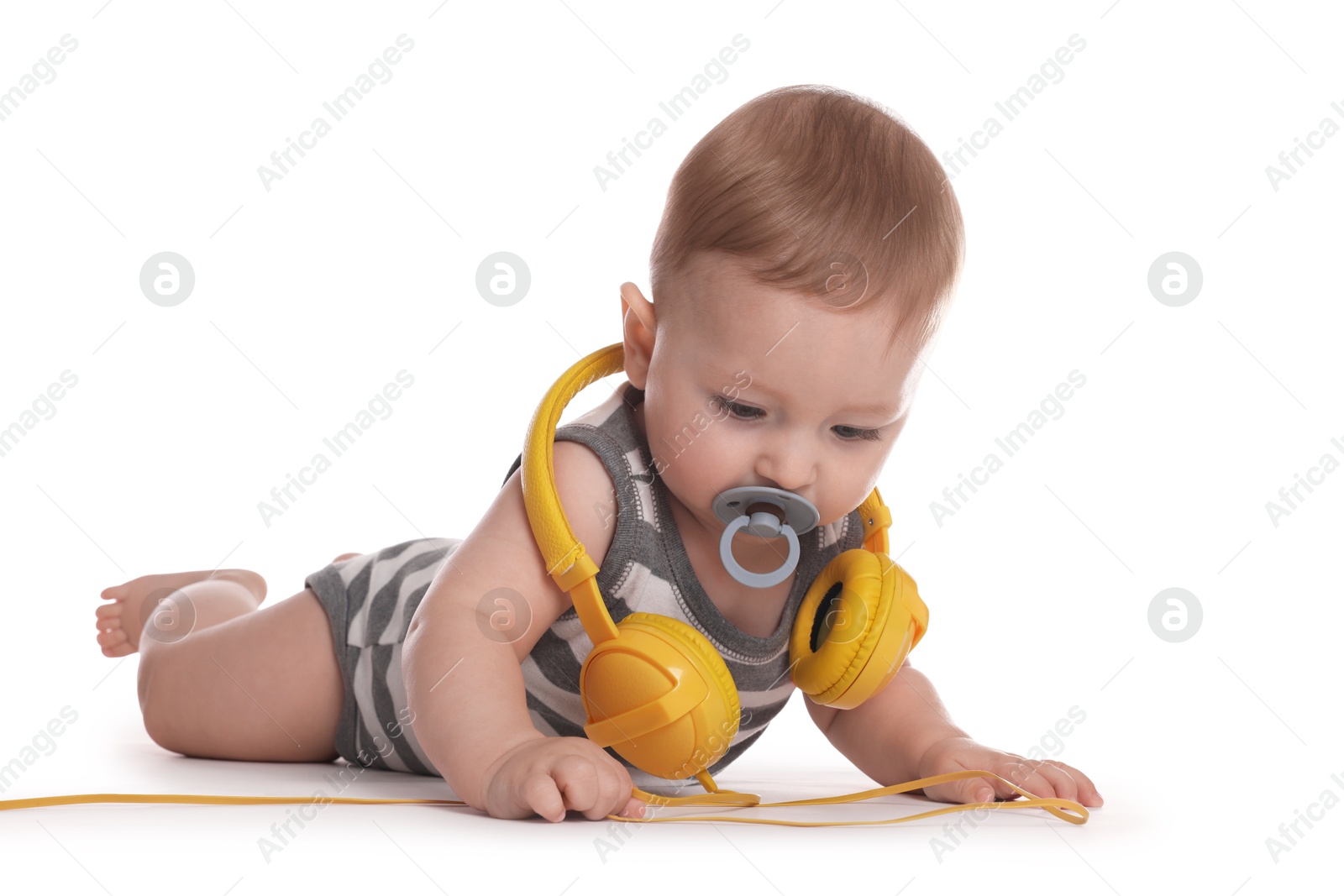 Photo of Cute little baby with pacifier and headphones on white background