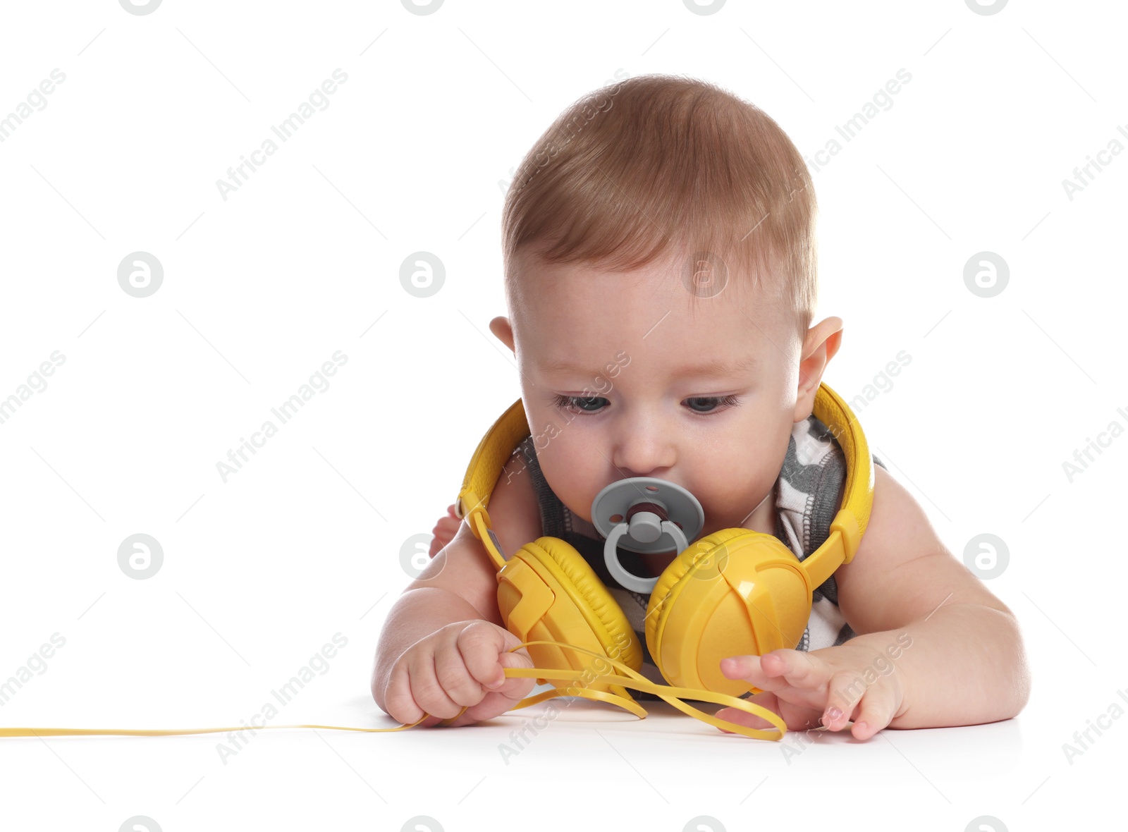 Photo of Cute little baby with pacifier and headphones on white background