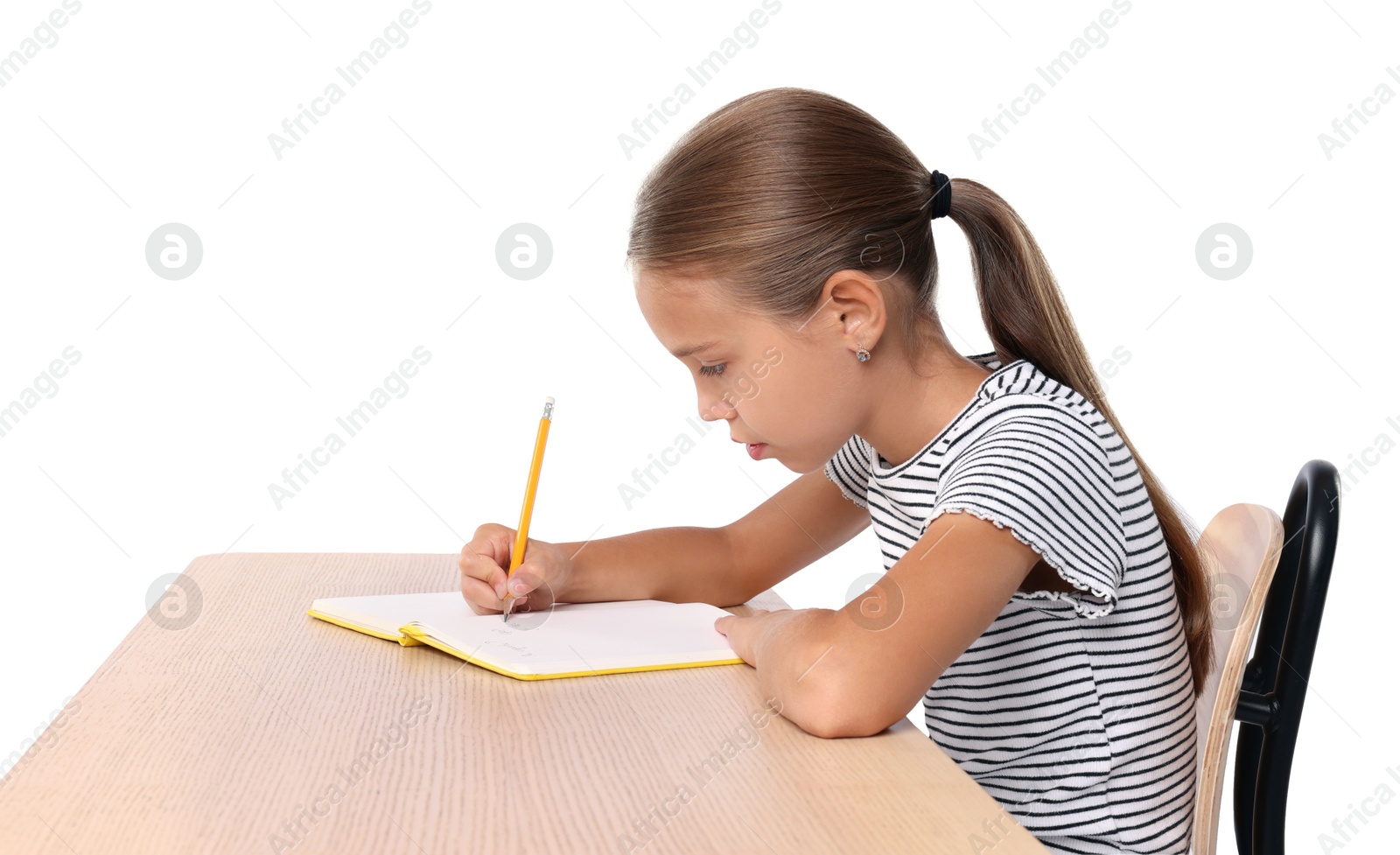 Photo of Girl with incorrect posture and notebook sitting at wooden desk on white background