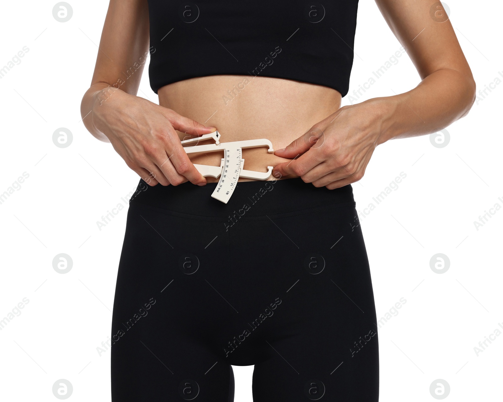 Photo of Woman measuring body fat with caliper on white background, closeup