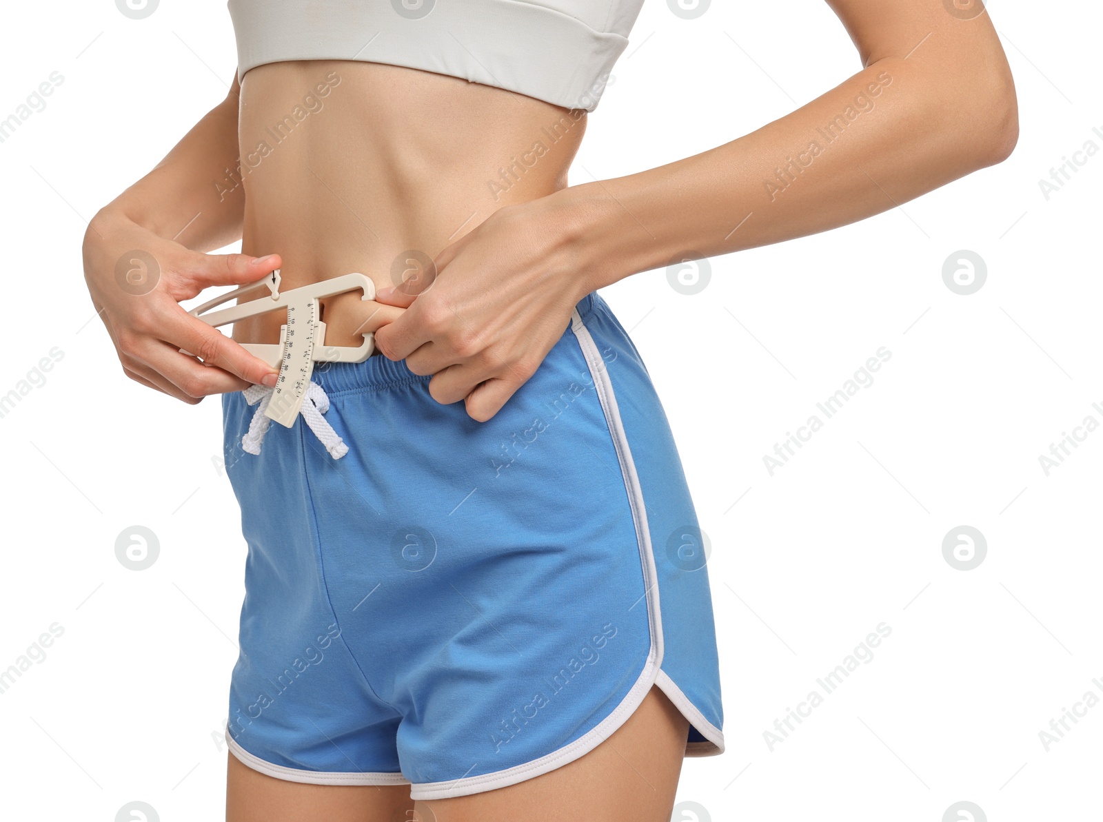 Photo of Woman measuring body fat with caliper on white background, closeup