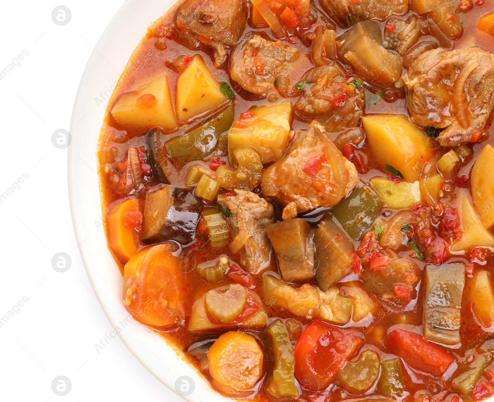 Photo of Delicious stew with vegetables in bowl isolated on white, top view