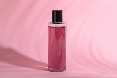 One shampoo in bottle on pink background