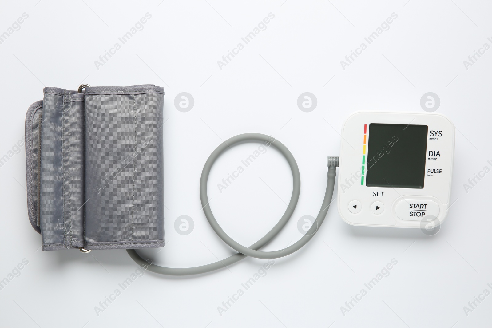 Photo of Blood pressure measuring device on white background, top view