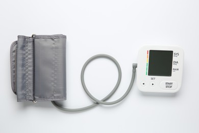 Photo of Blood pressure measuring device on white background, top view