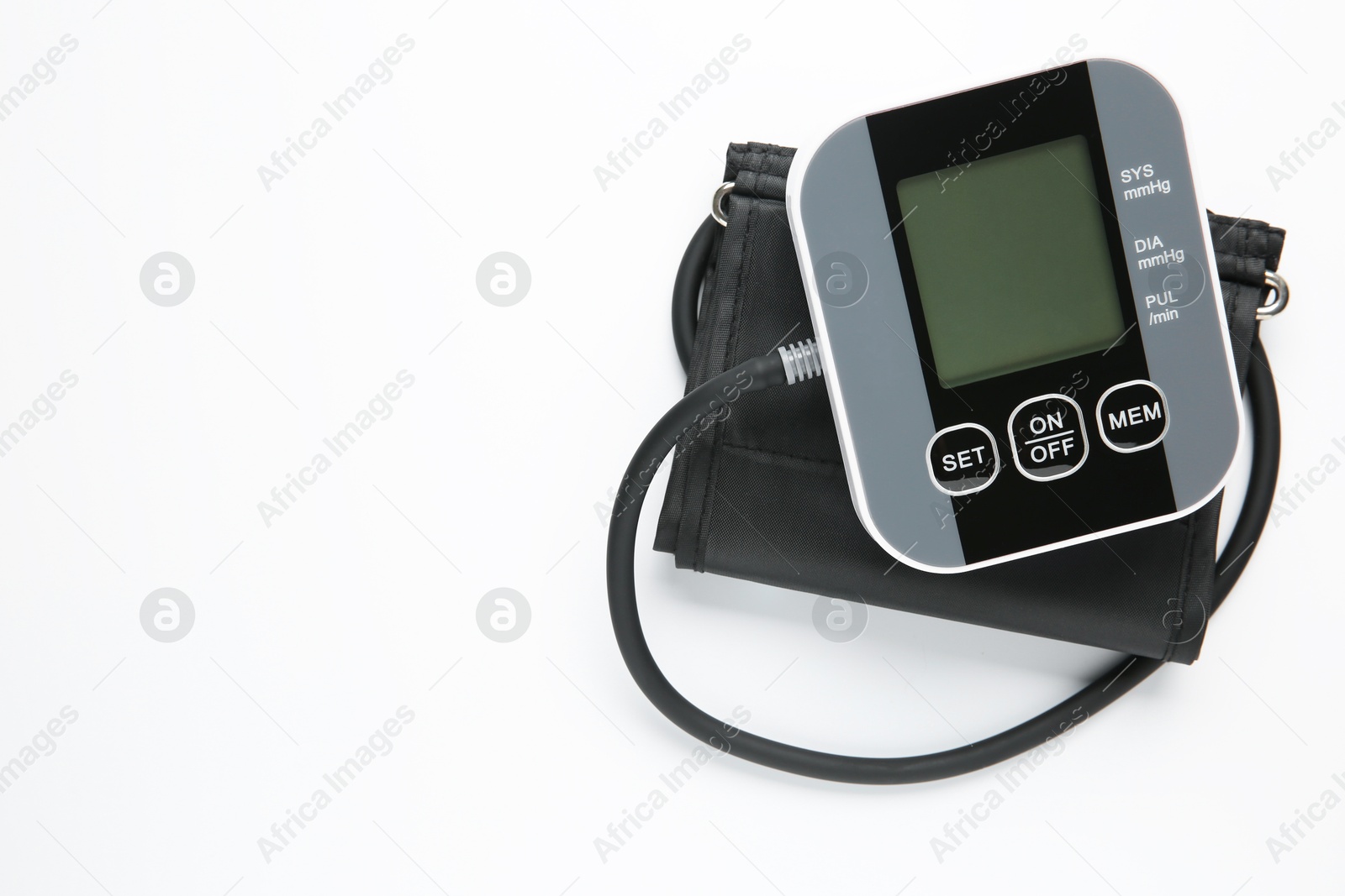 Photo of Blood pressure measuring device on white background, top view. Space for text