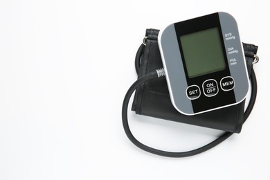 Blood pressure measuring device on white background, top view. Space for text