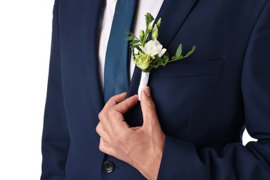 Photo of Groom in suit with stylish boutonniere on white background, closeup