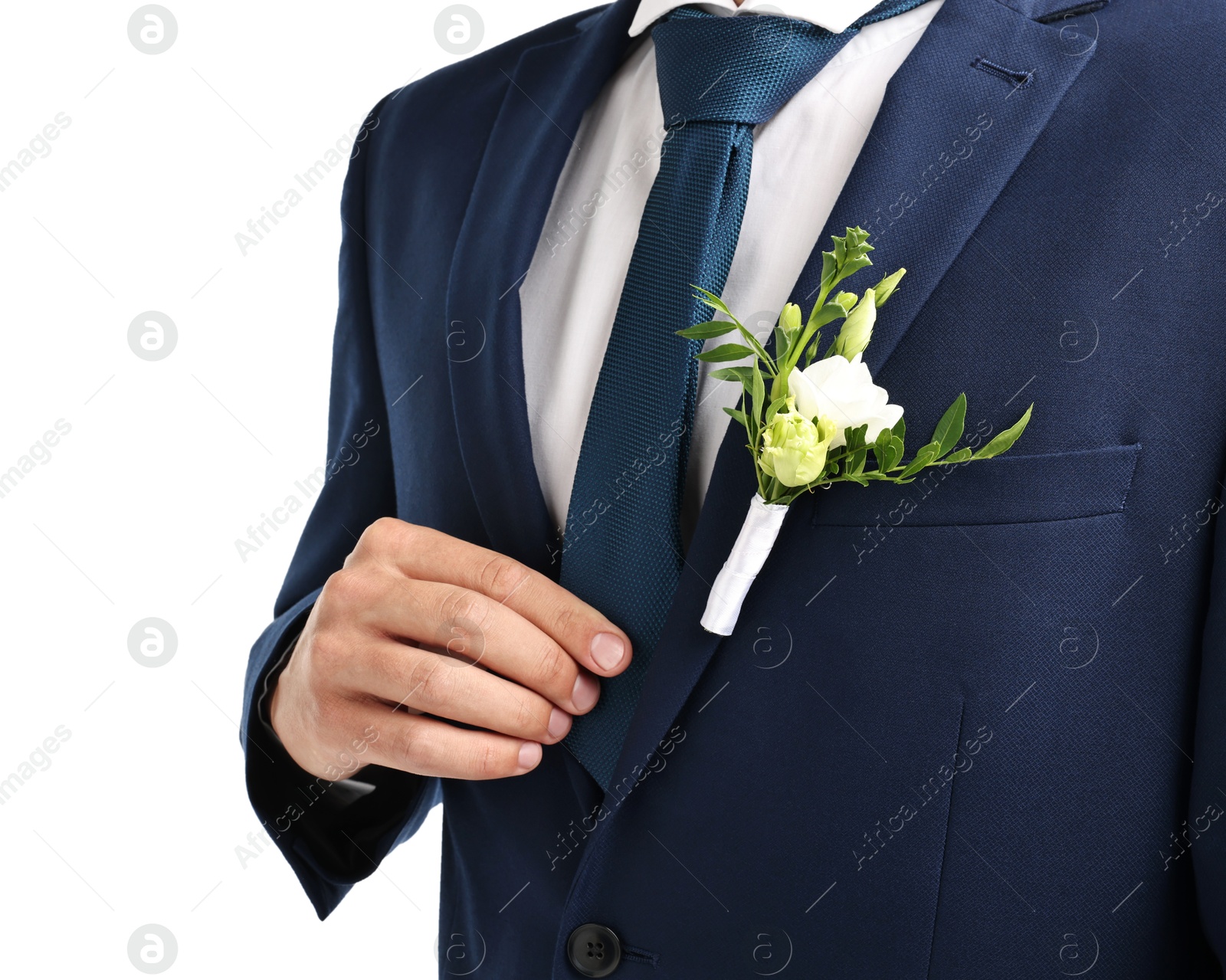 Photo of Groom in suit with stylish boutonniere on white background, closeup