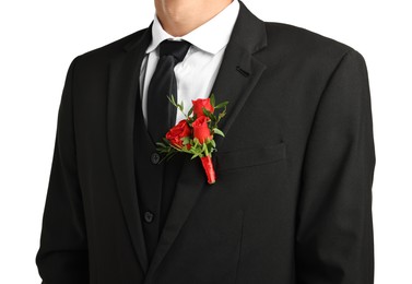 Photo of Groom in suit with stylish boutonniere on white background, closeup