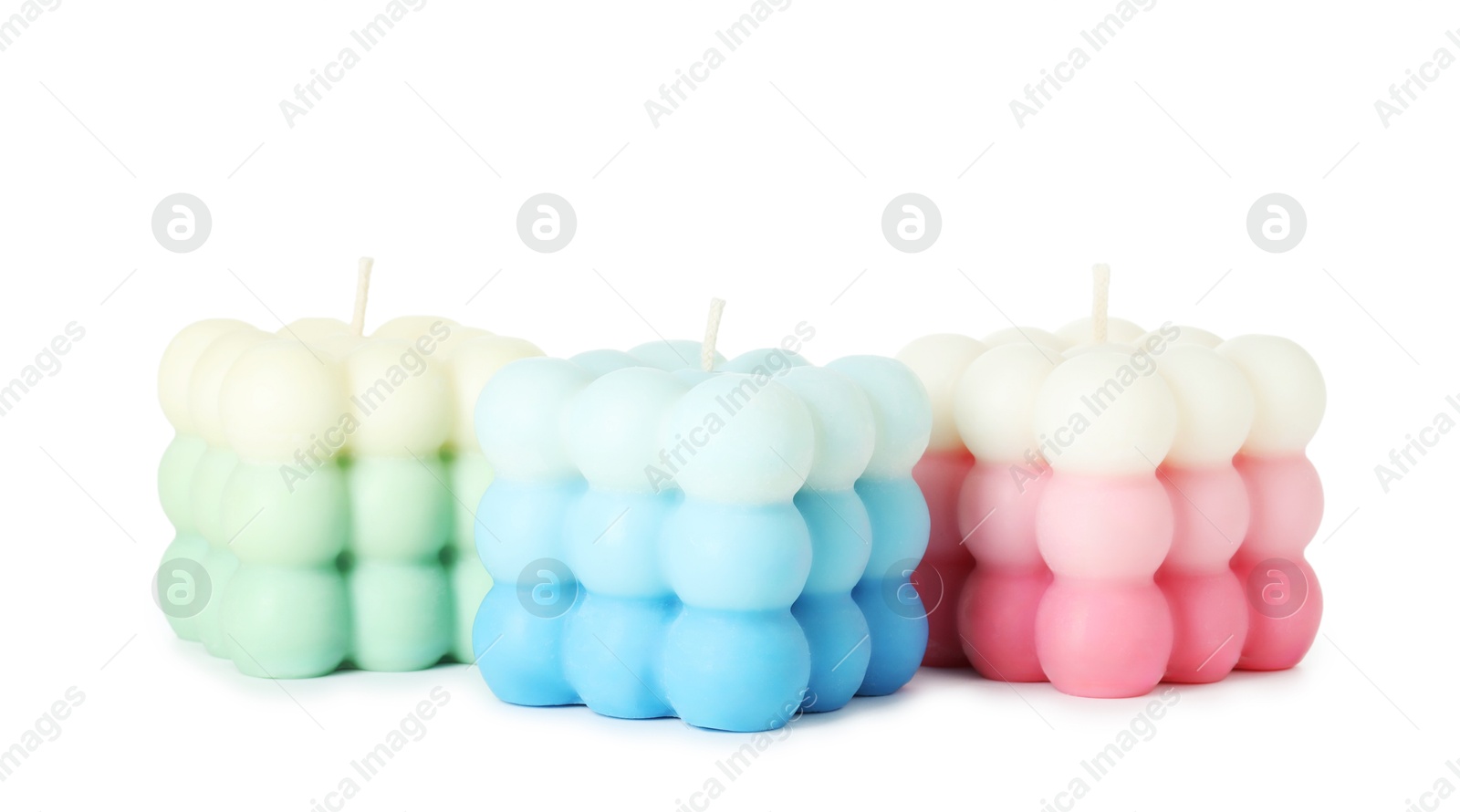 Photo of Three beautiful bubble candles isolated on white