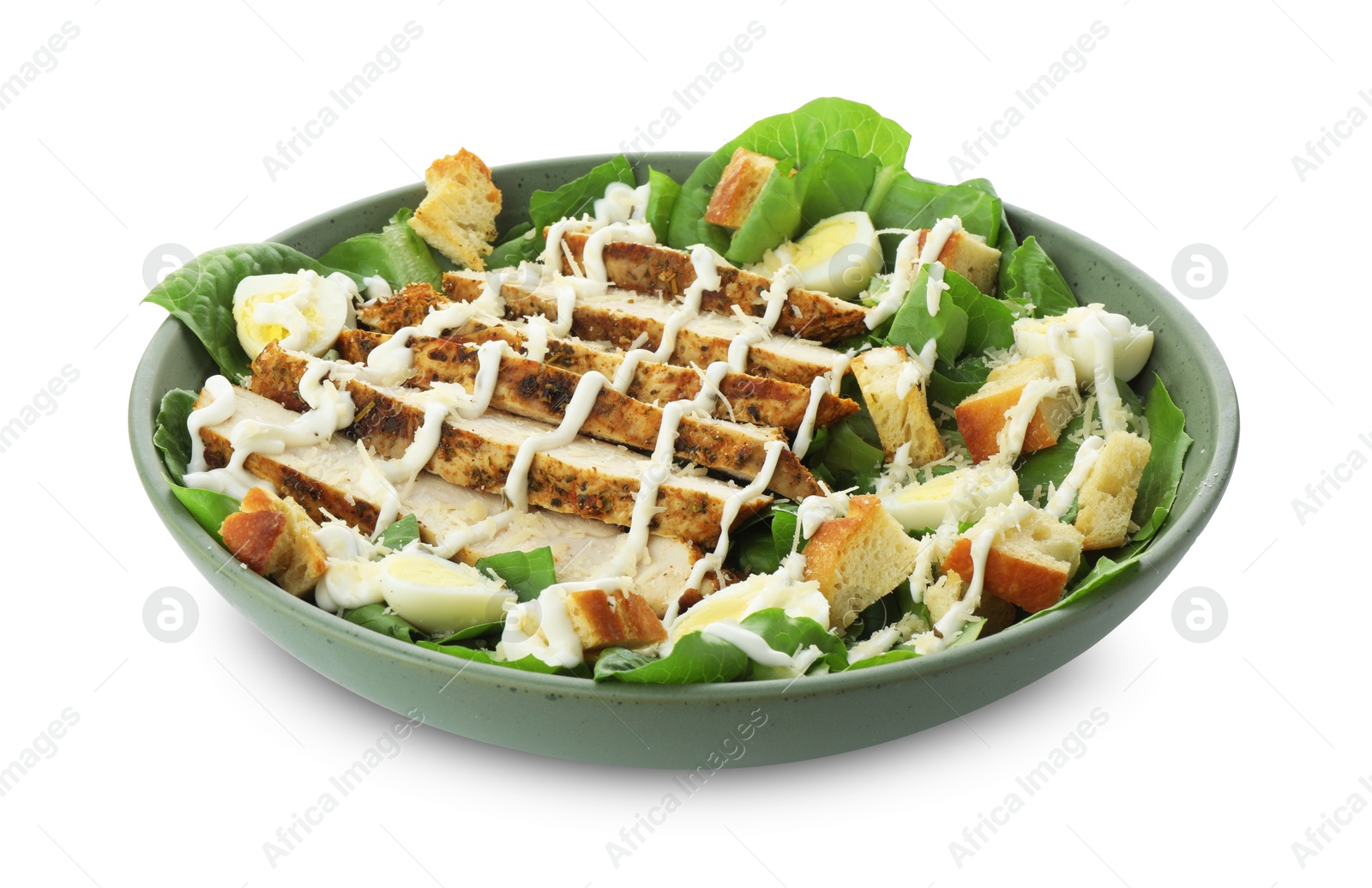 Photo of Delicious Caesar salad with chicken in bowl isolated on white