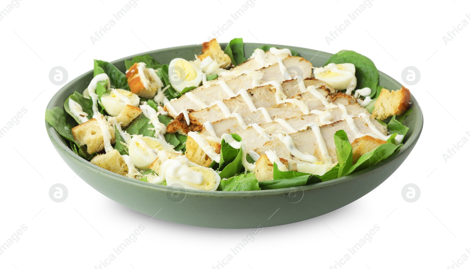 Photo of Delicious Caesar salad with chicken in bowl isolated on white