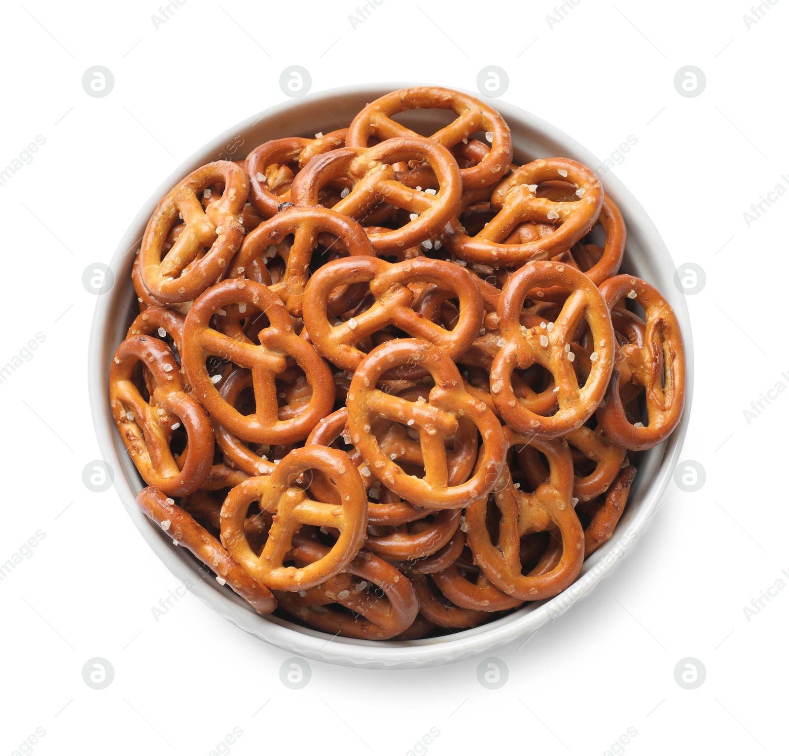 Photo of Delicious pretzel crackers in bowl isolated on white, top view