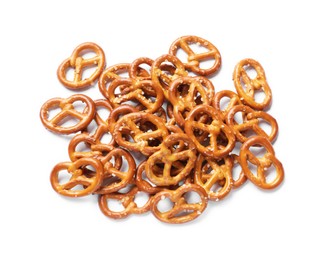 Photo of Many delicious pretzel crackers isolated on white, top view