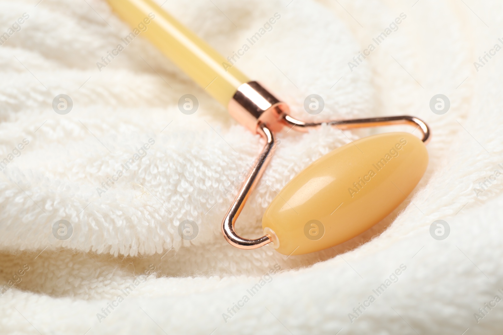 Photo of Face roller on light terry towel, closeup