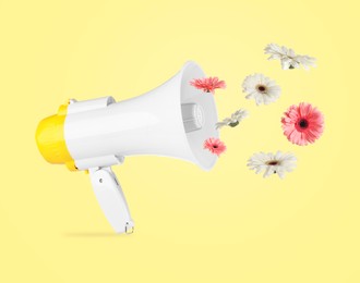 Image of Gerbera flowers flying out of loudspeaker on yellow background