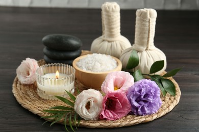 Photo of Spa composition with massage bags on wooden table