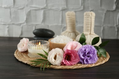 Photo of Spa composition with massage bags on wooden table