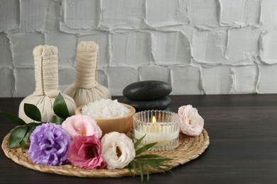 Spa composition with massage bags on wooden table