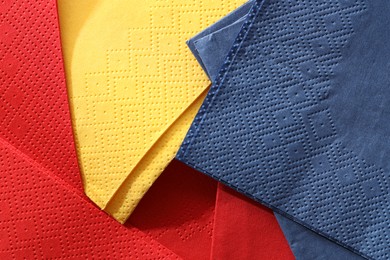 Photo of Red, yellow and blue tissues as background, top view