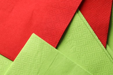 Photo of Red and green tissues as background, top view