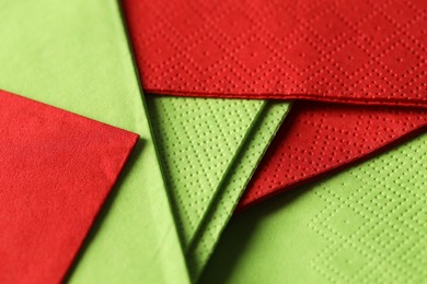 Photo of Red and green tissues as background, closeup