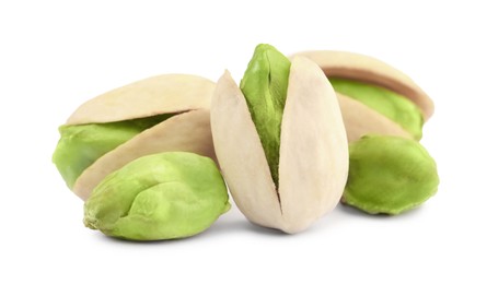 Image of Many tasty pistachio nuts on white background