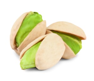 Image of Three tasty pistachio nuts on white background