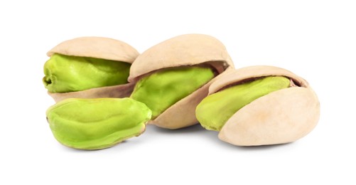 Image of Many tasty pistachio nuts on white background