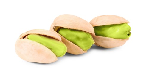 Image of Three tasty pistachio nuts on white background