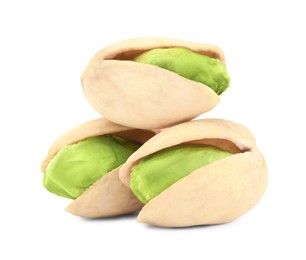 Image of Three tasty pistachio nuts on white background