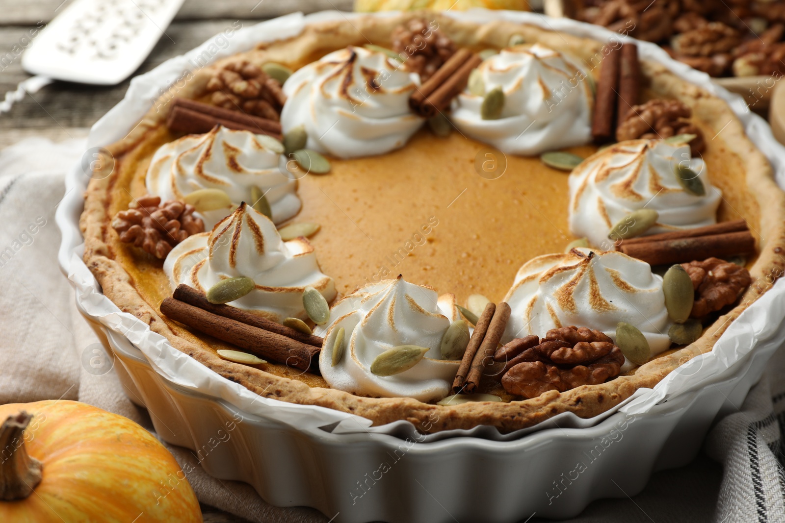 Photo of Tasty homemade pumpkin pie in baking dish on table, closeup