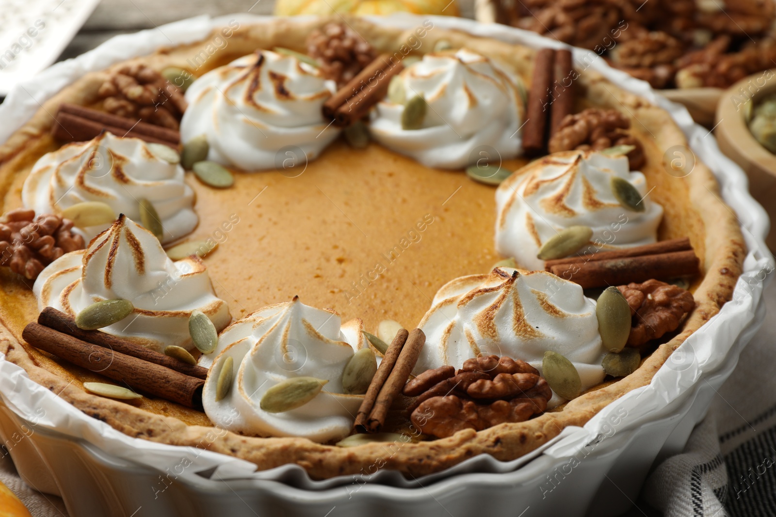 Photo of Tasty homemade pumpkin pie in baking dish on table, closeup