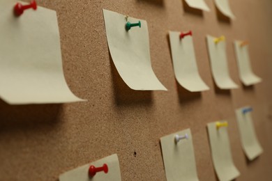 Photo of Many paper notes pinned to cork board