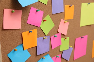 Photo of Many blank colorful notes pinned to corkboard