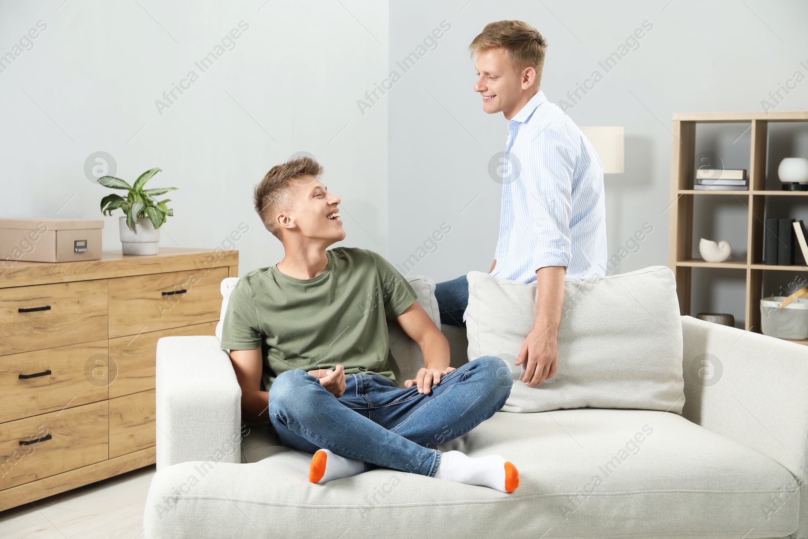 Photo of Happy brothers spending time together at home