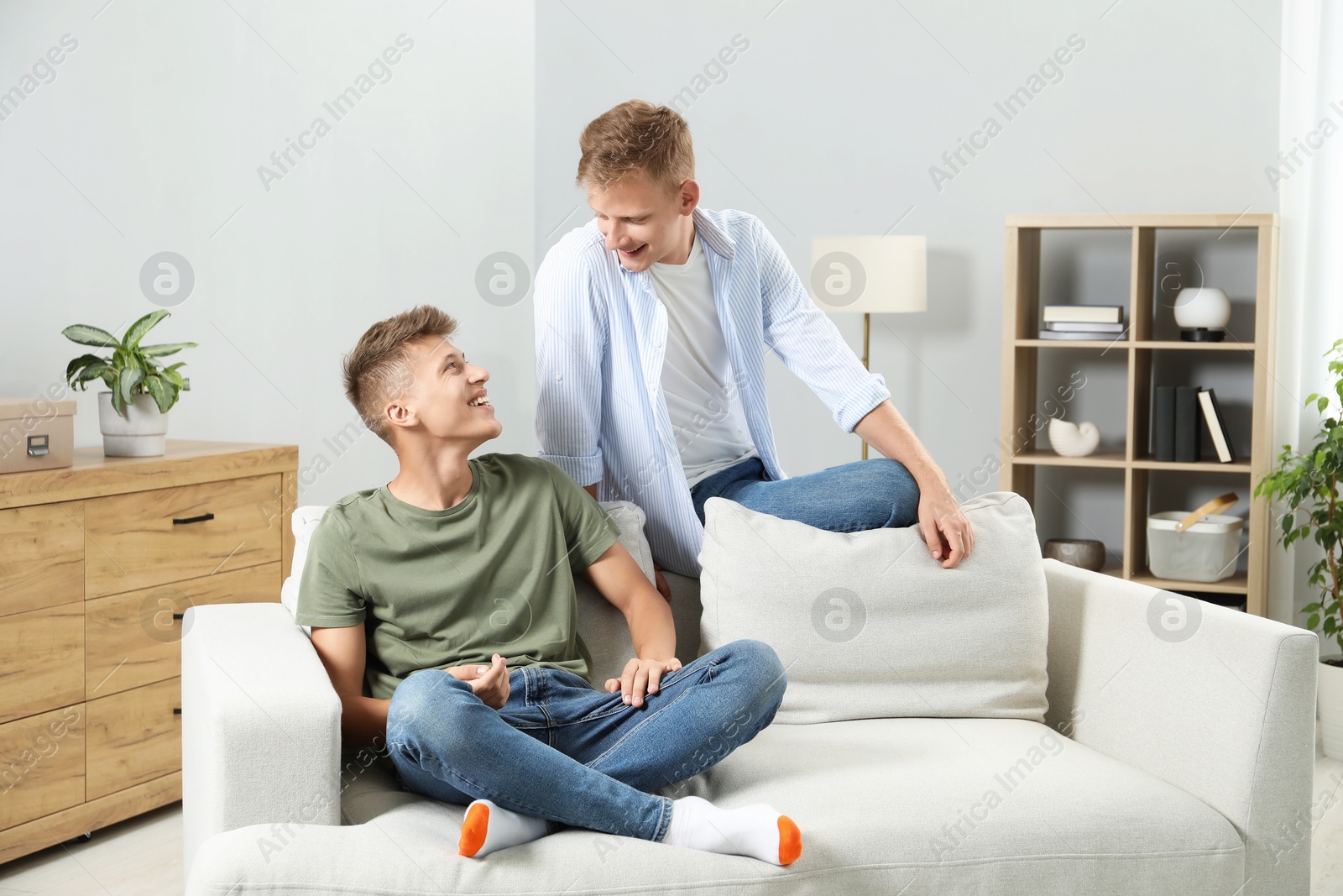 Photo of Happy brothers spending time together at home