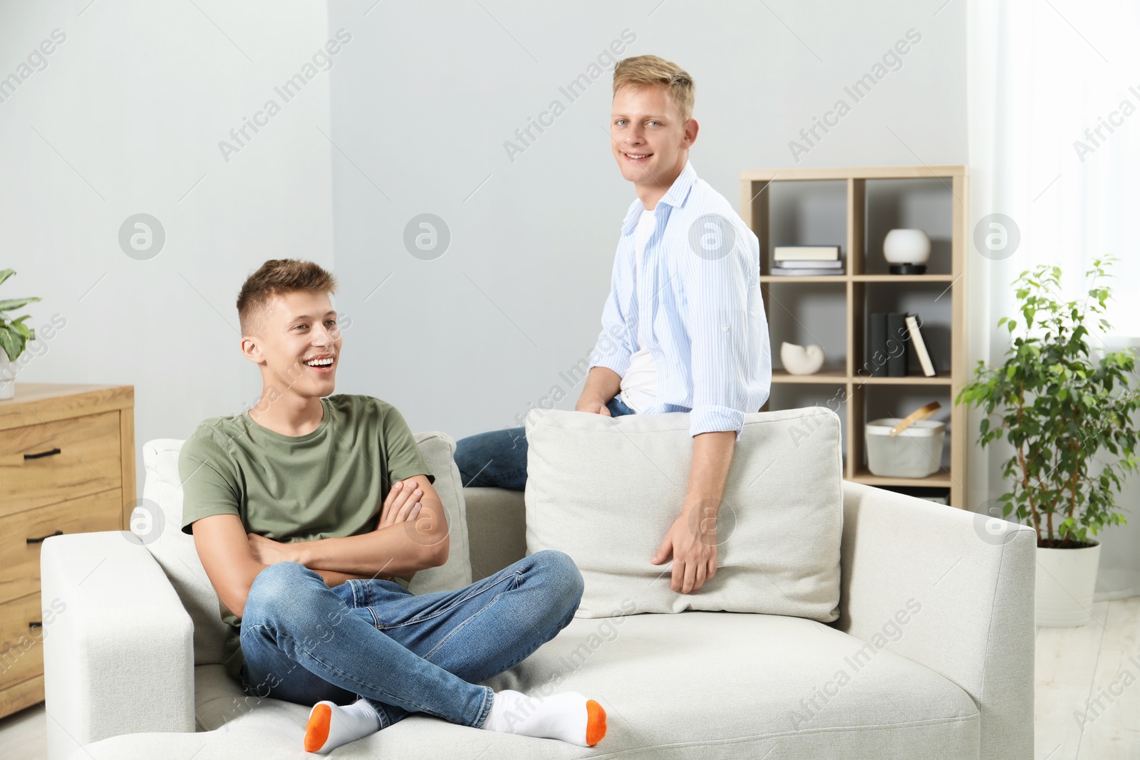 Photo of Happy brothers spending time together at home