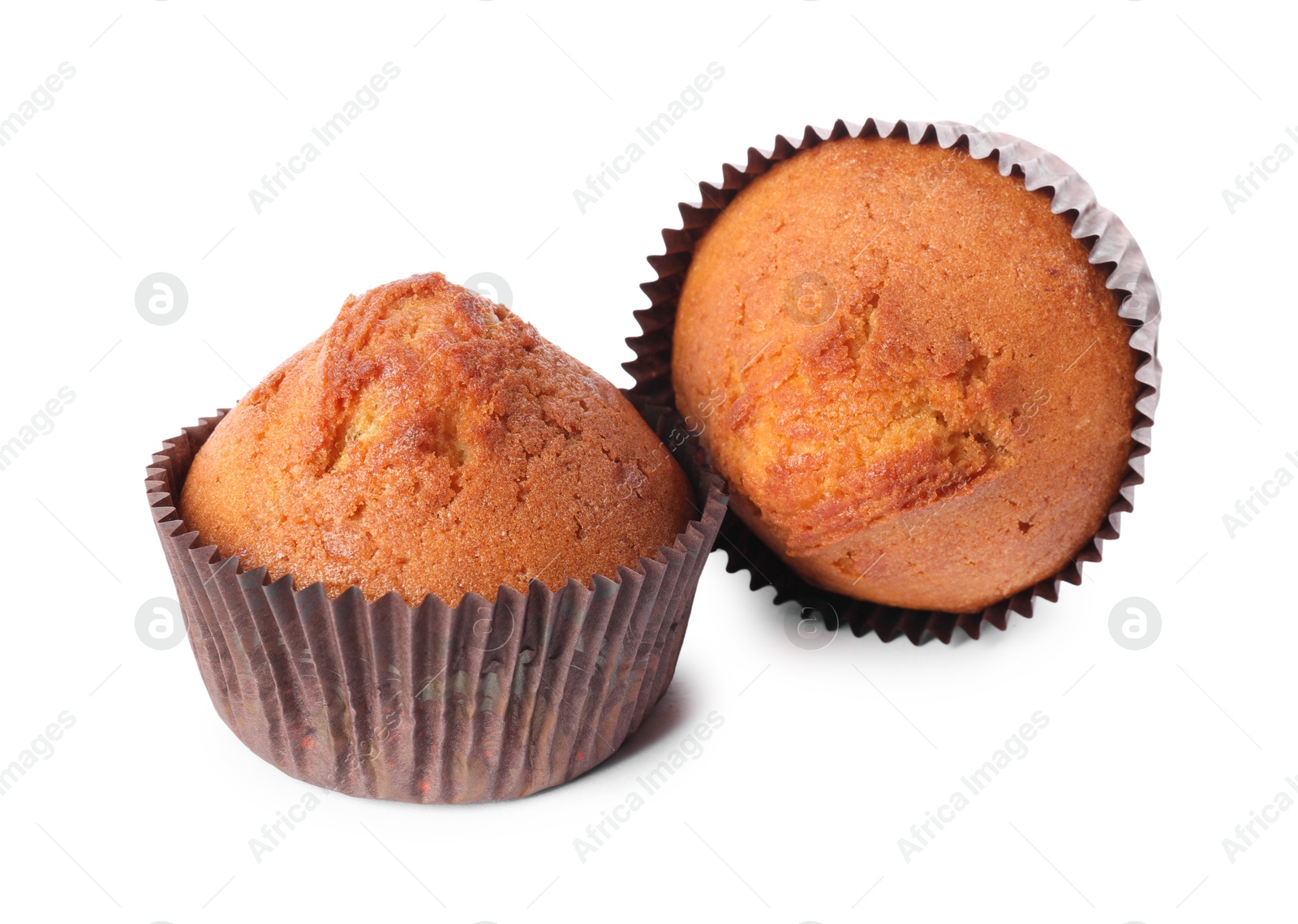 Photo of Two delicious sweet muffins isolated on white